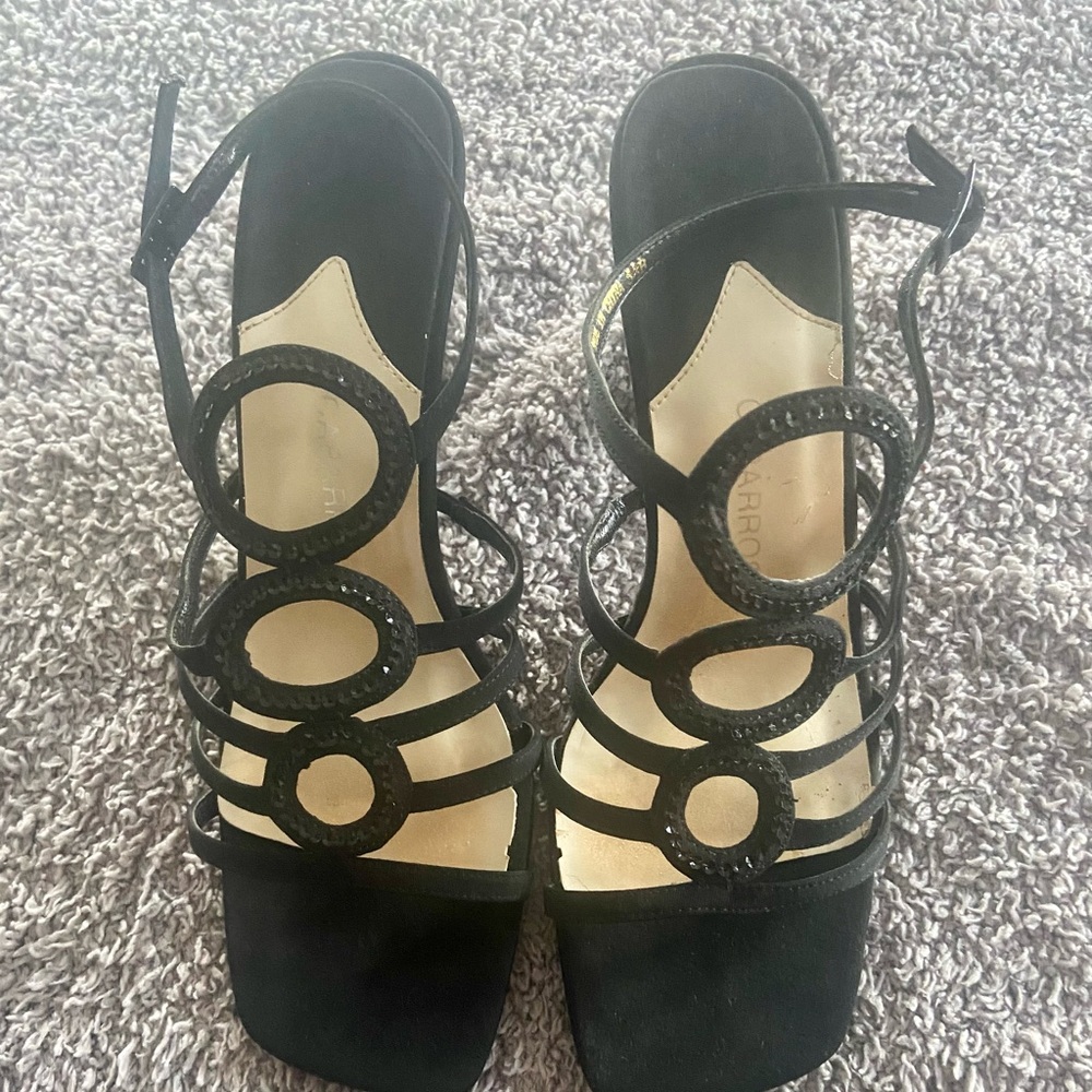 Black dress sandals. Size 6. 3 inch heel with strap.